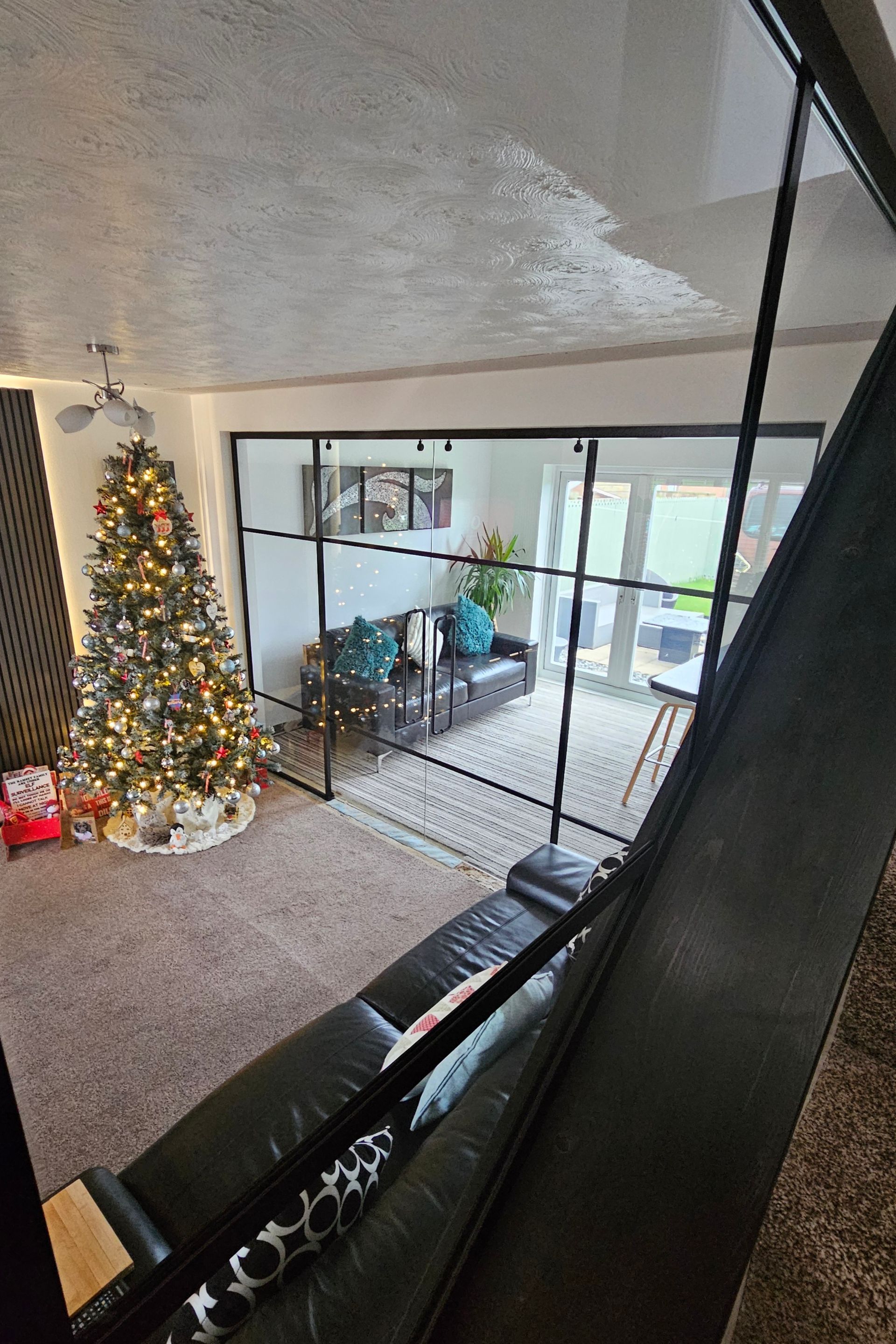 Frameless internal glass doors enhancing light in Northumberland home