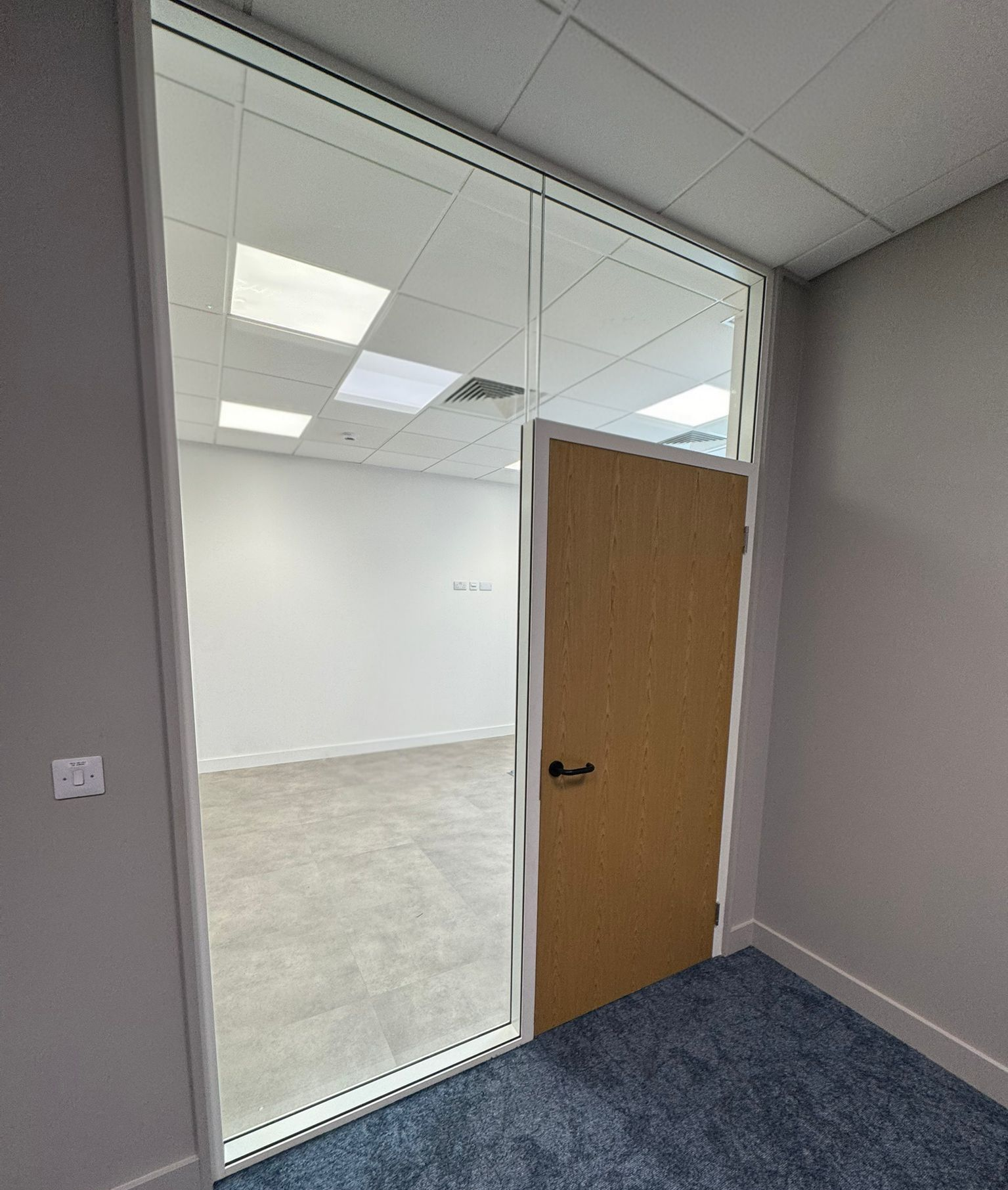 Frameless double glazed partitions and oak timber doors creating new office spaces in Stockton