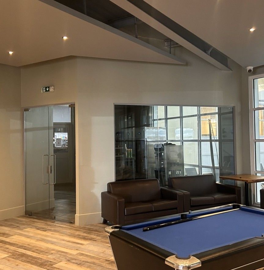Single Glazed Glass Partition with Frameless Double Glass Doors for a Sports & Social Setting in Devon