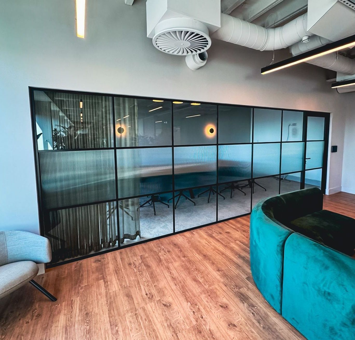 Banded Industrial Office Glass Partition with Reeded / Fluted Manifestation including an Acoustic Framed Door
