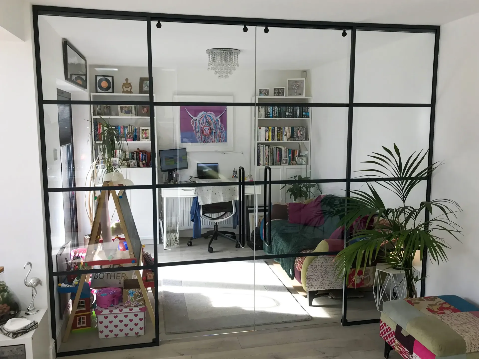 Glass Partition for Home Office with Frameless Double Sliding Glass Doors, enhanced by Aluminium Crittall Style Banding to create an Industrial Aesthetic