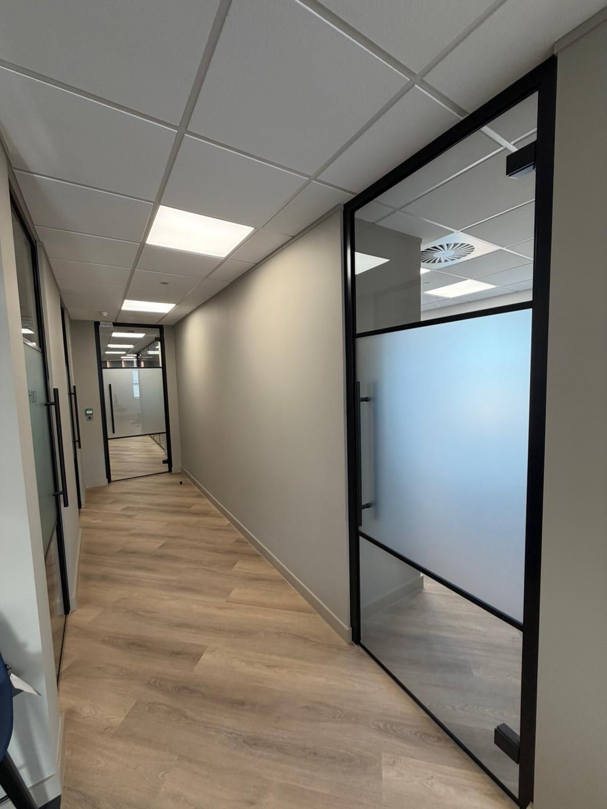 Standalone glass doors installed into dry lined openings 