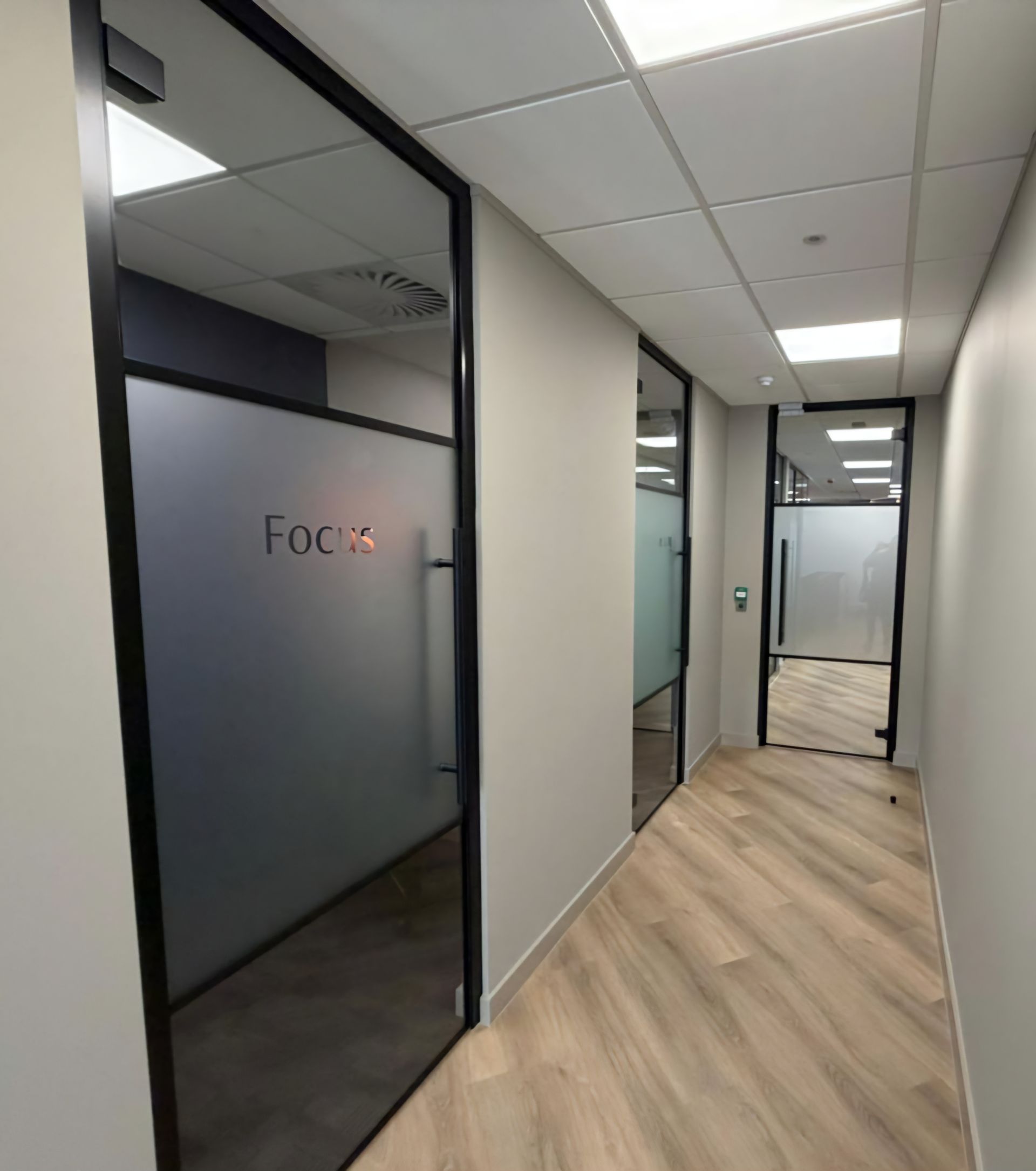 Standalone glass doors installed into dry lined openings by Clear Divide