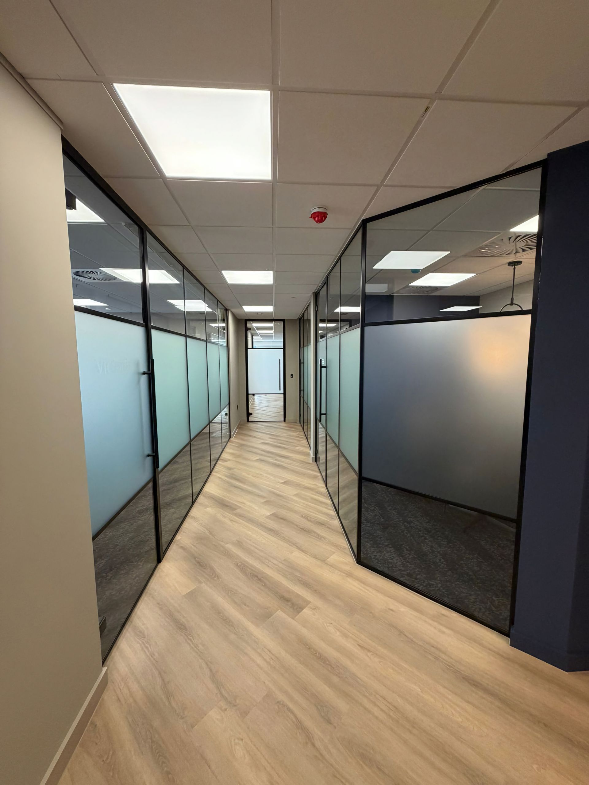 Banded acoustic glass office partitions installed on the South Coast