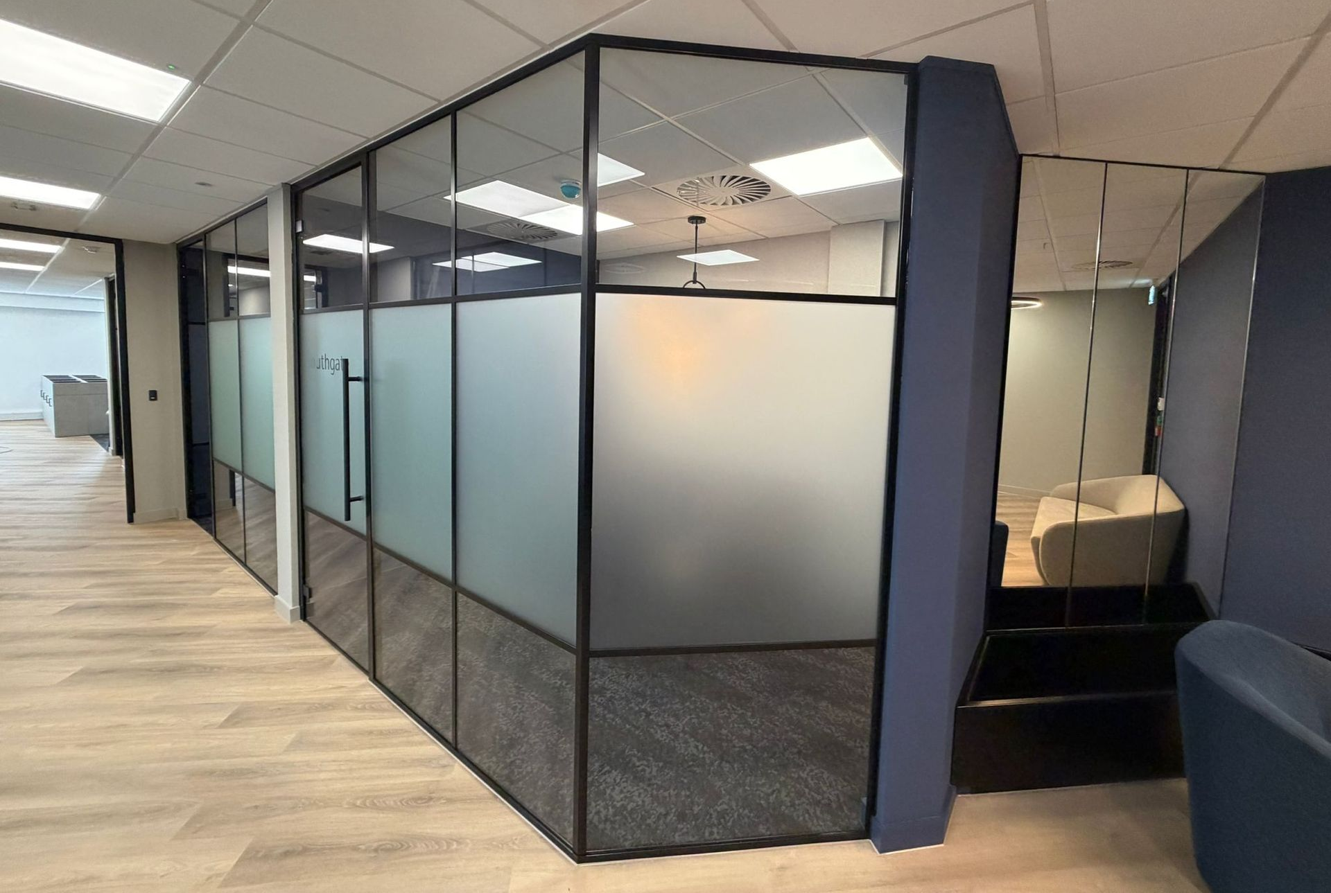 Faceted angled glass partitions commercial installation