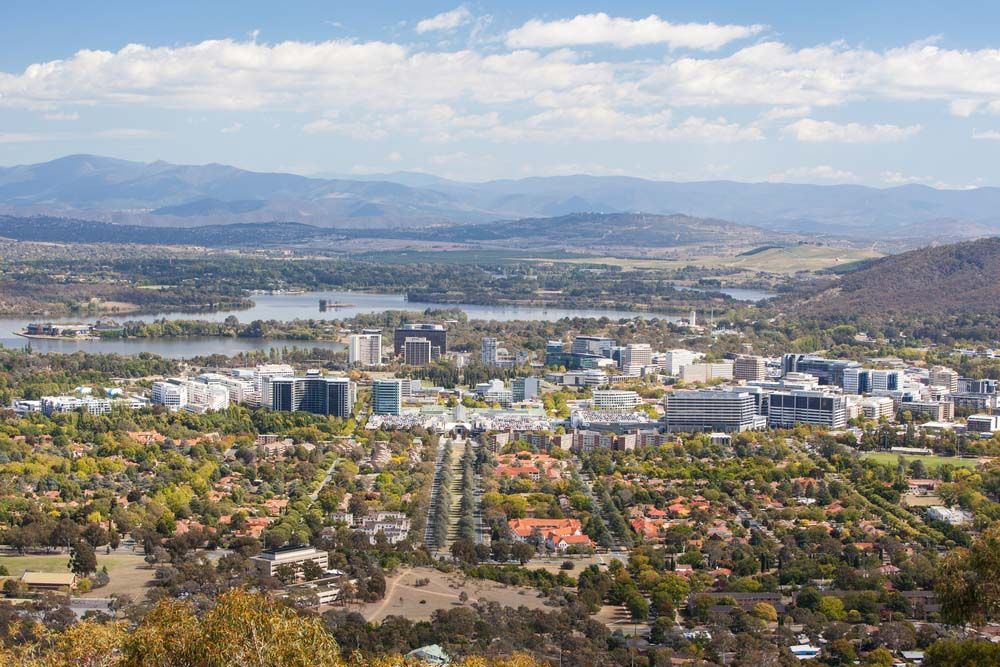 Aerial View of City with Mountains — NBM Constructions in Canberra