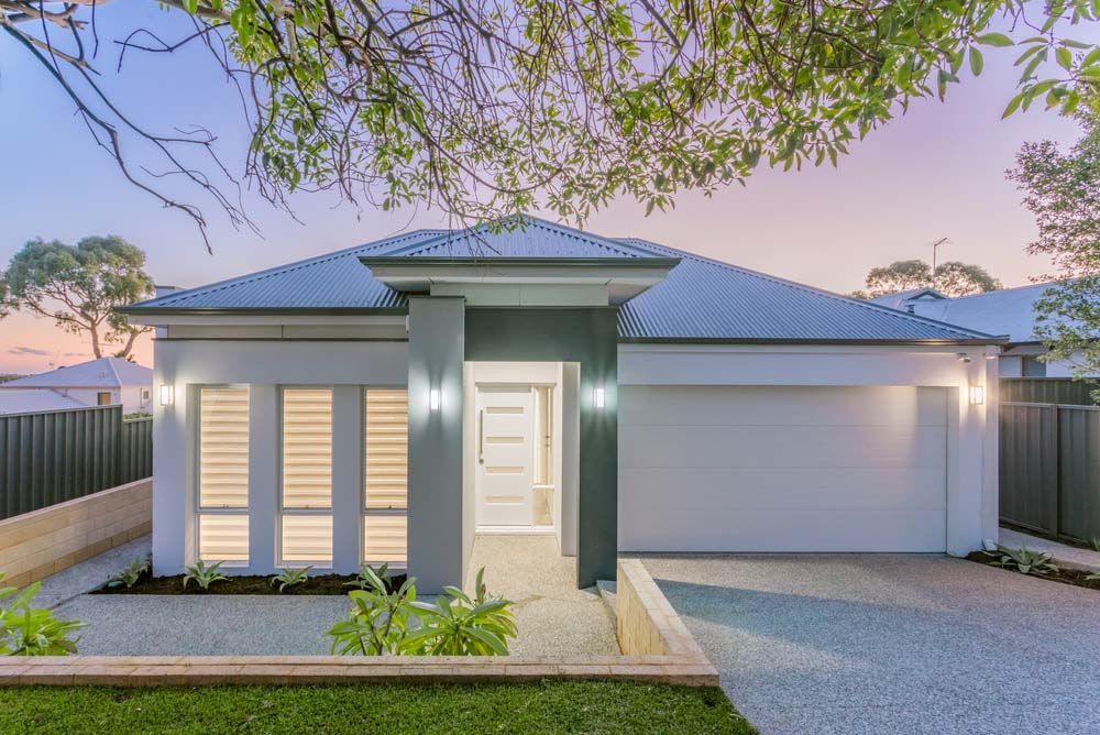 House with Blue Roof and White Door — NBM Constructions in Canberra