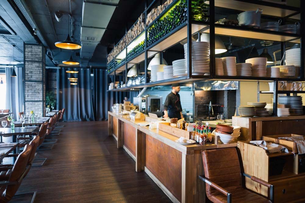 Chef Preparing Food in Restaurant — NBM Constructions