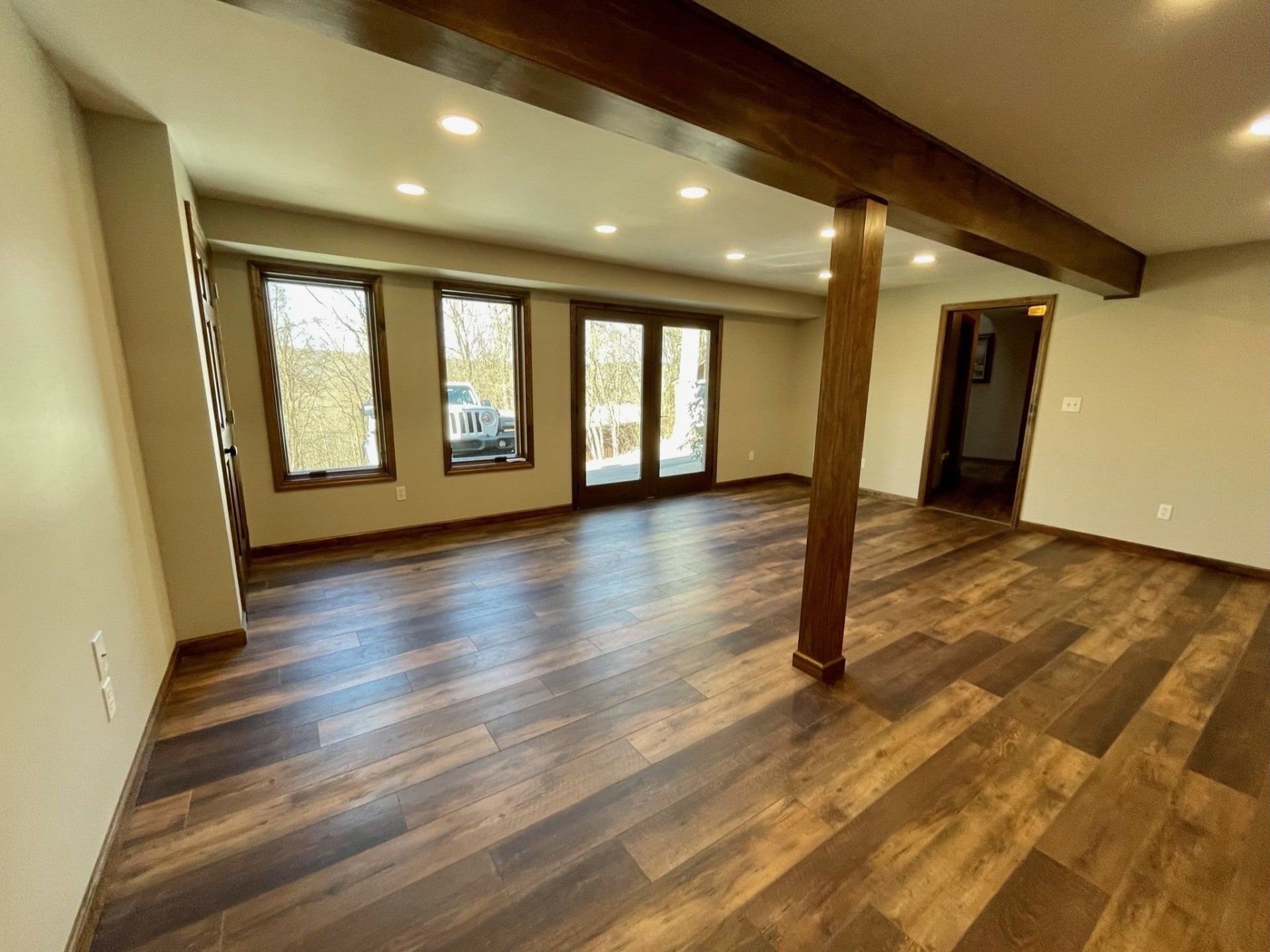 Basement with Windows and Hard Wood Flooring