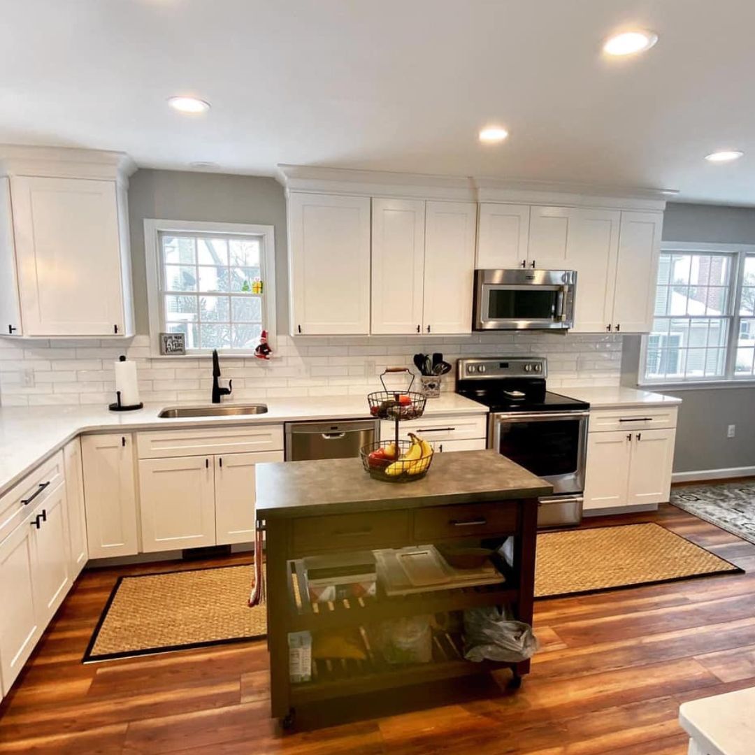 Open Kitchen with White Cabinets and Harwood Floor