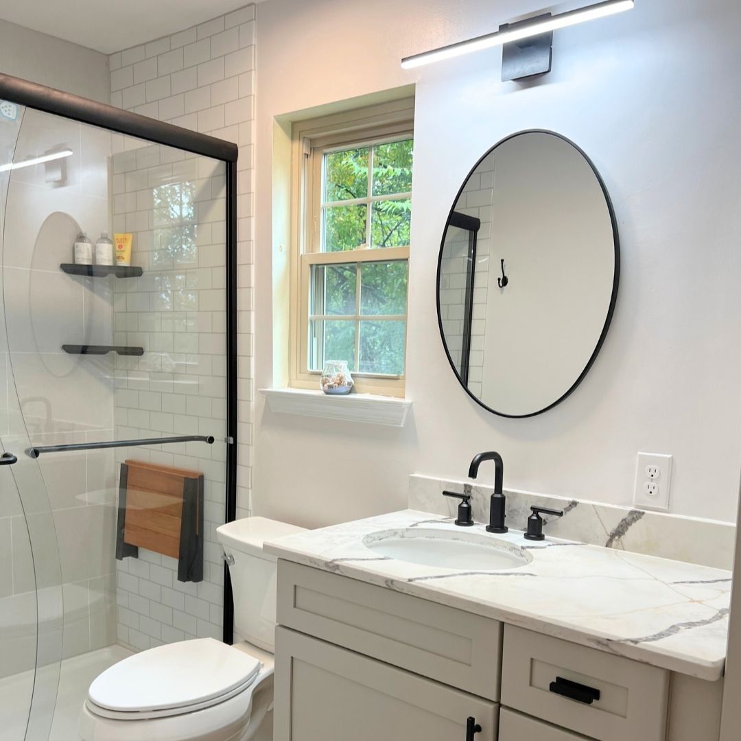 Modern Bathroom with Lighting, Cabinets and Shower.