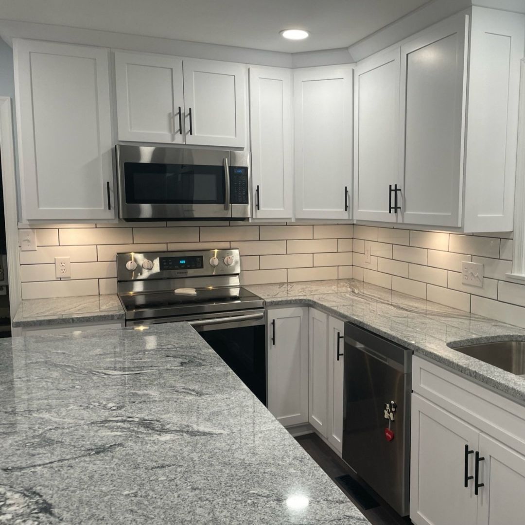 Stunning Kitchen with White Cabinets and Marble Tops