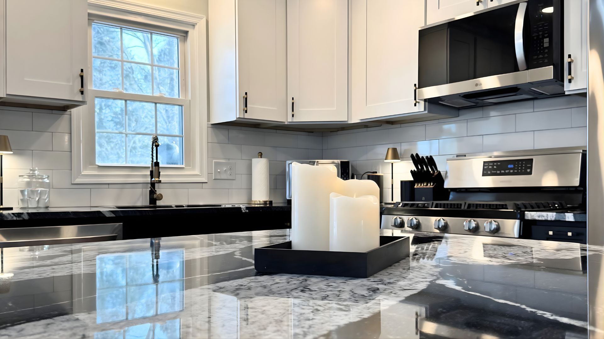 Kitchen Remodel with Marbled Countertop and White Candles