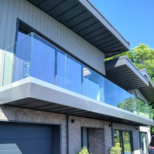 Hendrefoilan property with balcony. Frameless glass channel balustrade installed by Swansea Glass Balustrades.