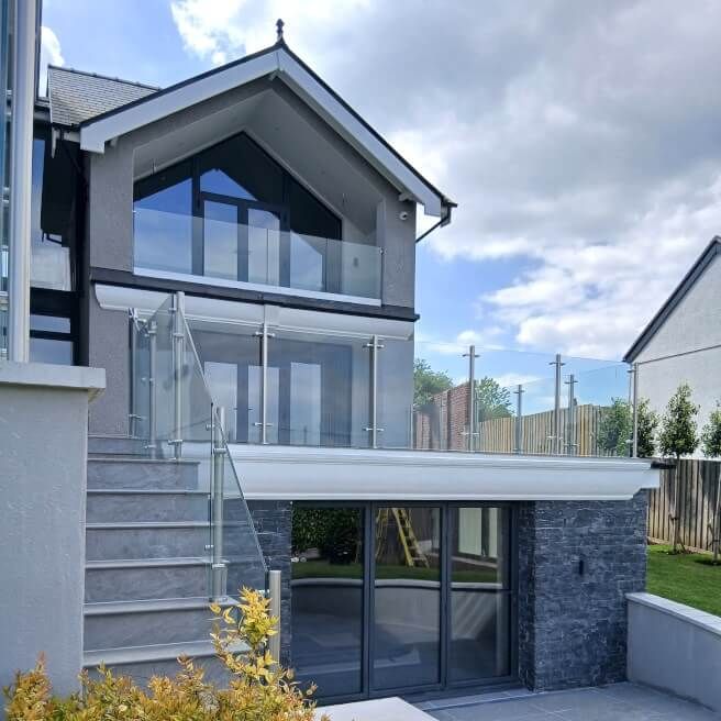 Langland modern property with Glass Balustrade post system. Installed by Swansea Glass Balustrades.