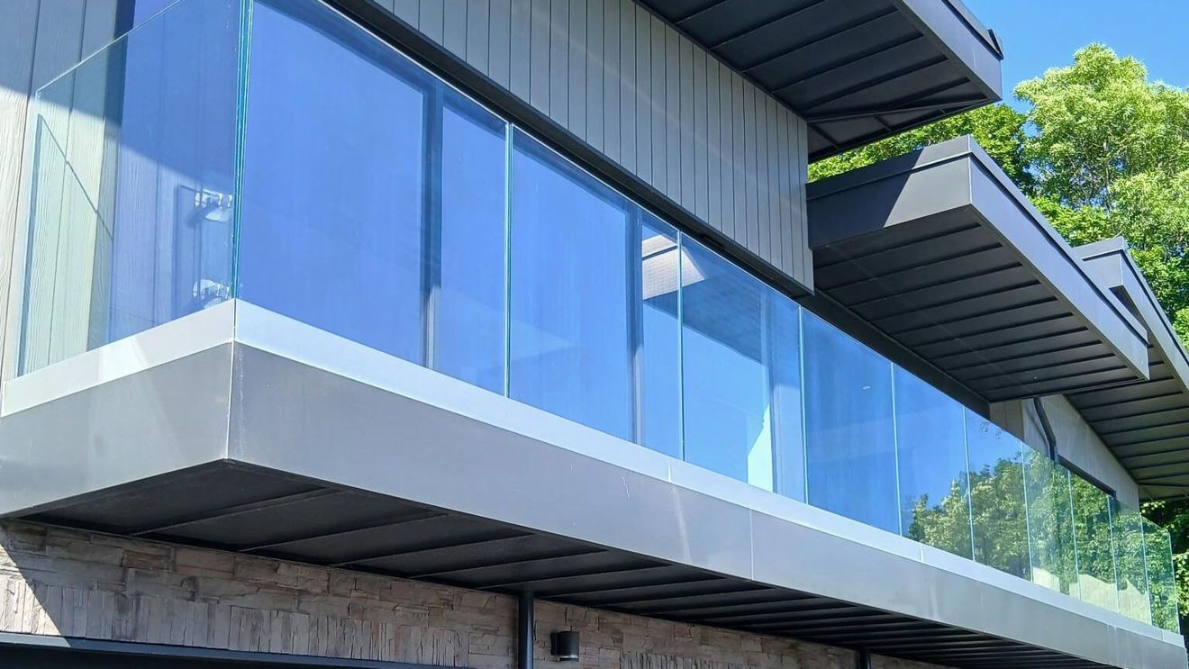 Torquay apartment building with steel railings installed by Swansea Glass Balustrades.