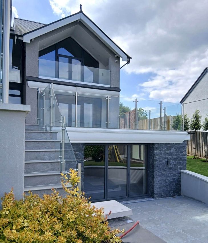 Langland modern property with Glass Balustrade post system. Installed by Swansea Glass Balustrades.