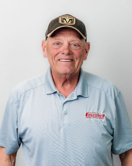 A man wearing a ram hat and a polo shirt