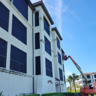 A large building with a crane on the side of it