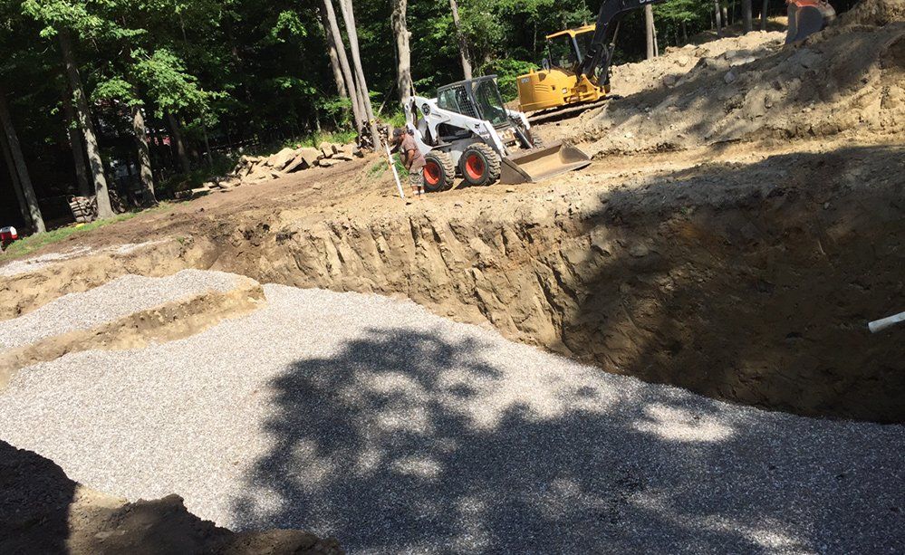 A bulldozer is digging a hole in the ground.