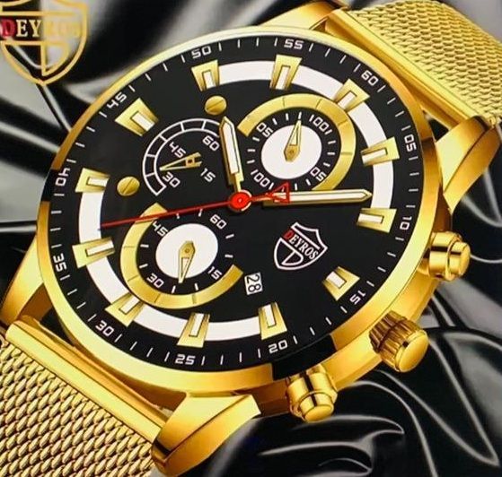 Een goud en zwart horloge met het woord dey erop