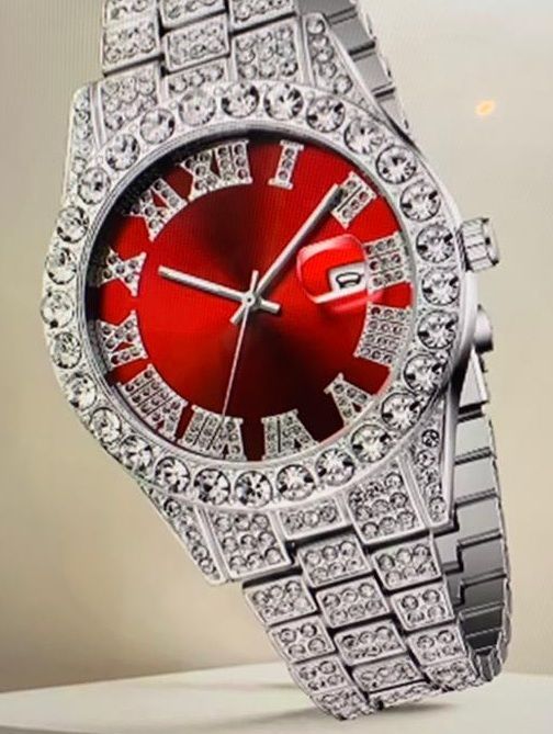 Een zilveren horloge met een rode wijzerplaat en Romeinse cijfers
