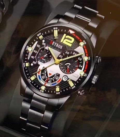 Een zwart horloge met het nummer 12 op de wijzerplaat