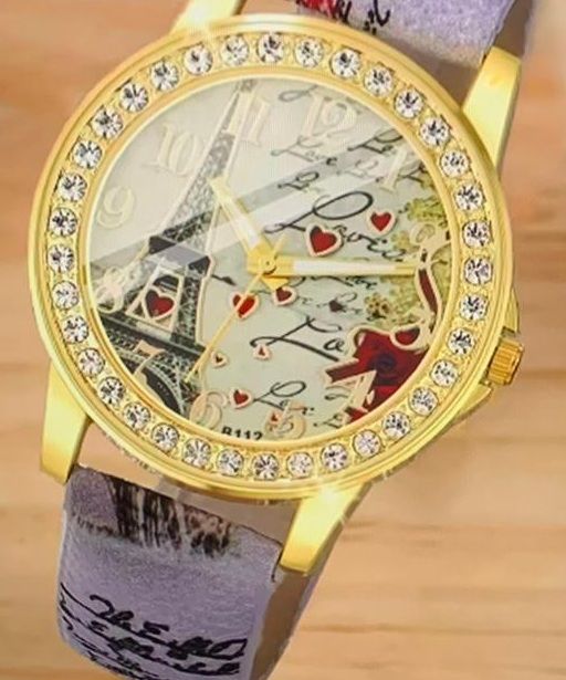 Een horloge met een afbeelding van de Eiffeltoren erop