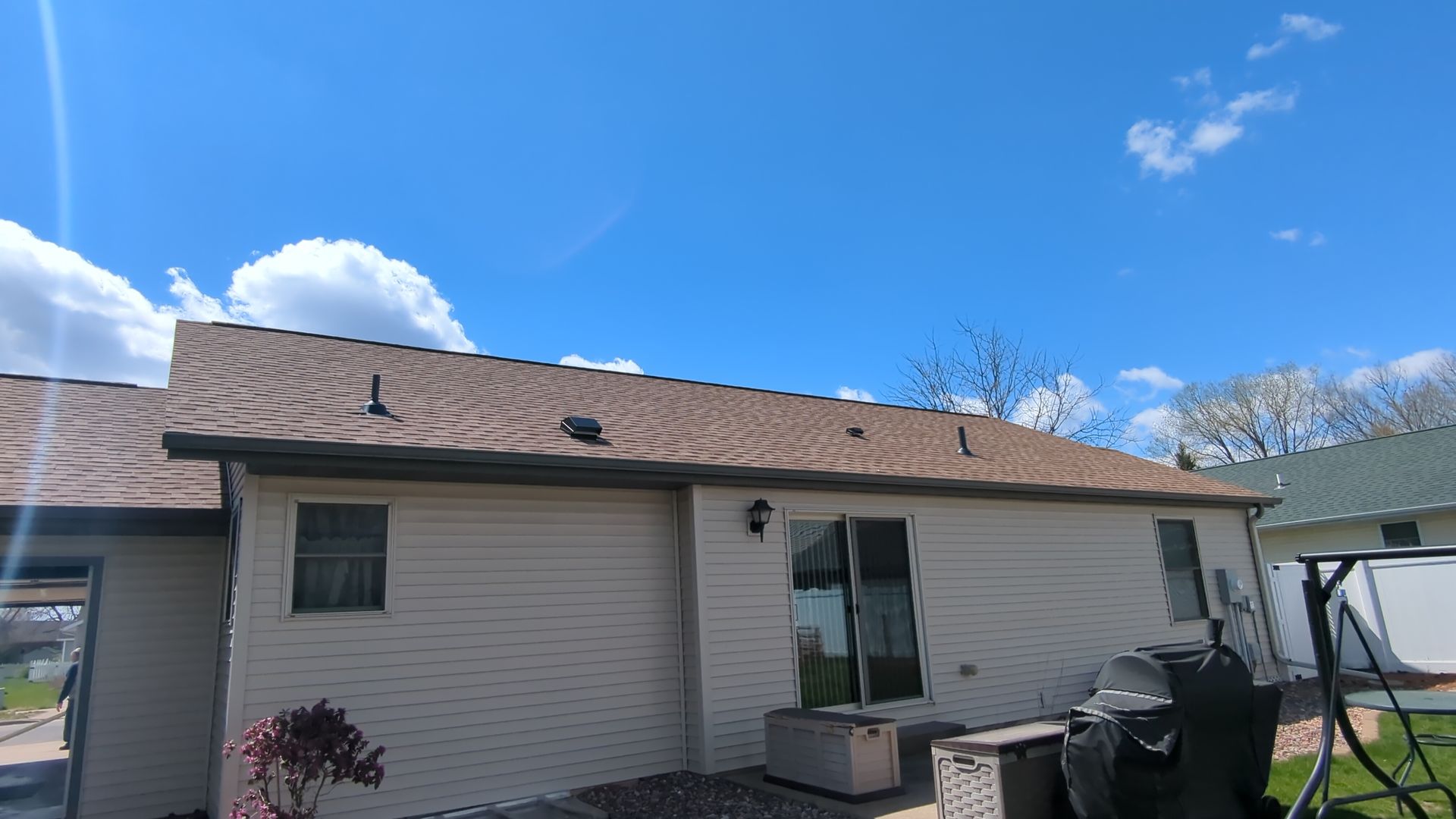 newly installed shingle roof in Janesville, Wisconsin with several roof vents