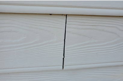 Siding with cracks in the seams.