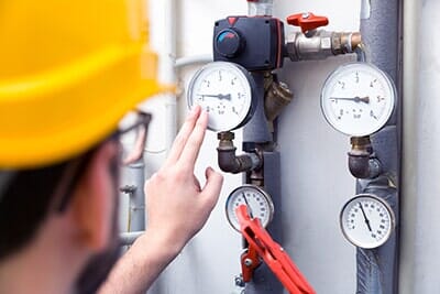 Maintenance – Technician Checking Pressure Meters for House Heating System in Marietta, PA