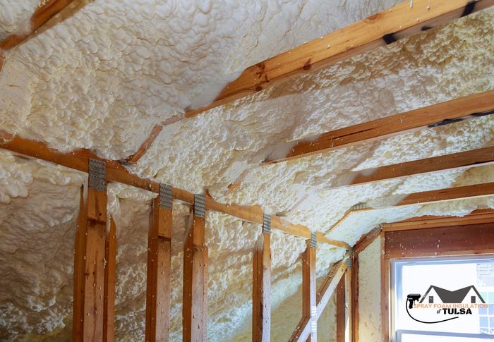 attic of Tulsa home with spray foam insulation installed by professionals