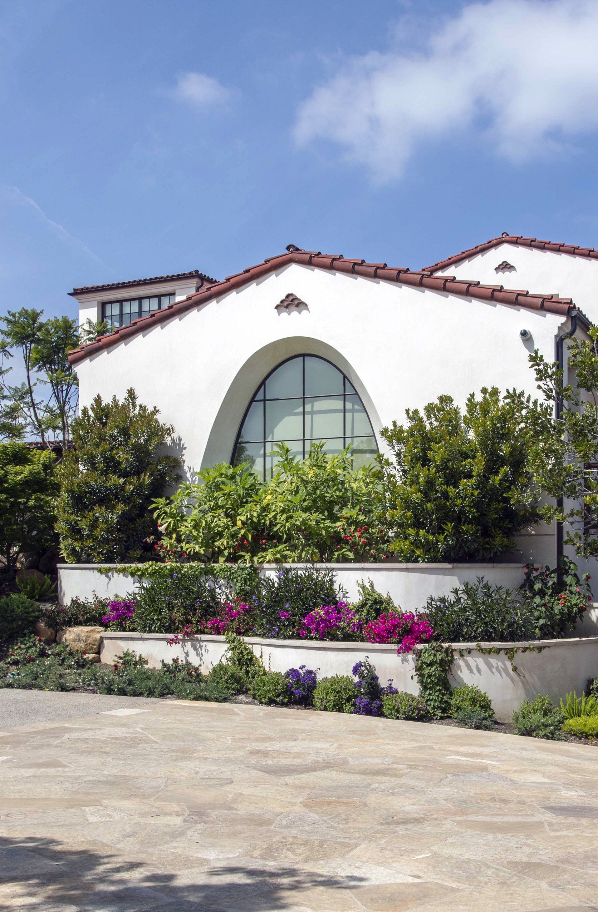 Exterior of a Santa Barbara style home in Irvine designed by Oatman Architects