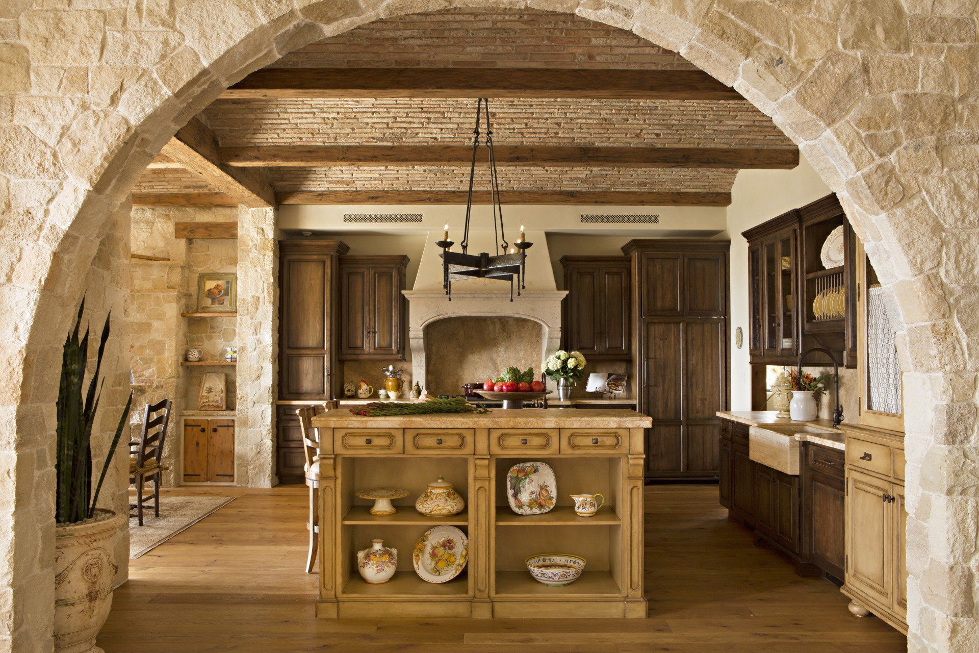 Kitchen in a Tuscan stone villa in Corona Del Mar designed by Oatman Architects