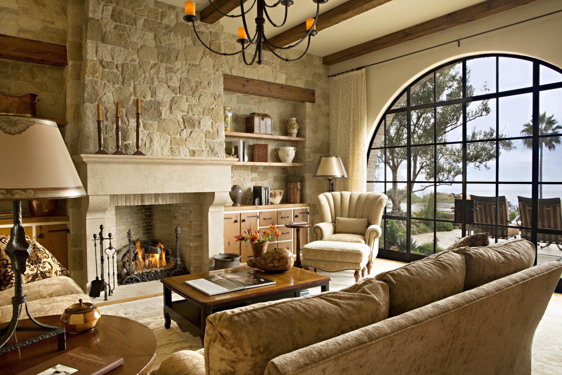 Living room in a Tuscan stone villa in Corona Del Mar designed by Oatman Architects