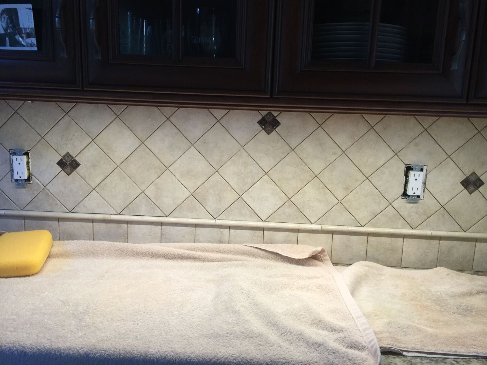 A towel is laying on a counter in a kitchen