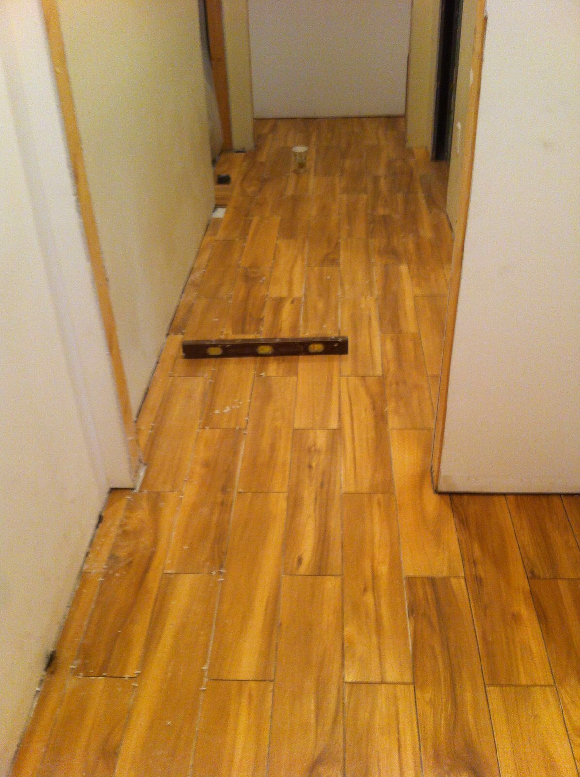 A wooden floor with a level on it