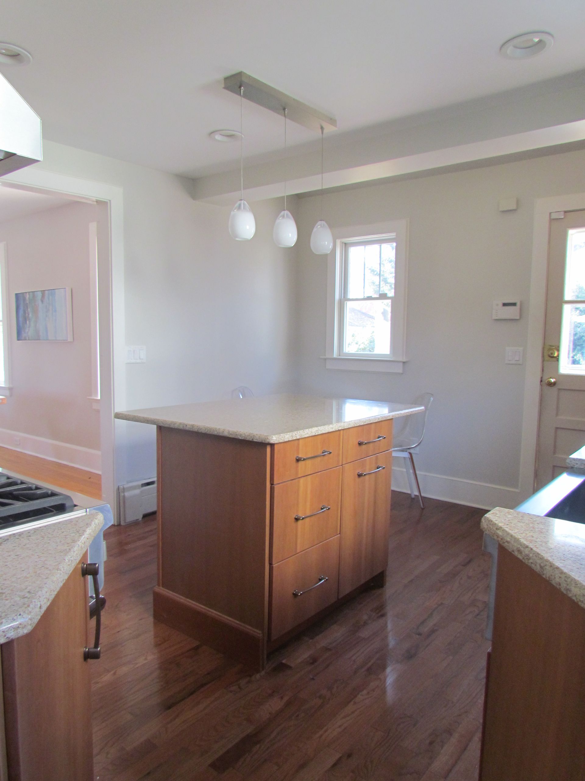 A kitchen with a large island in the middle of it