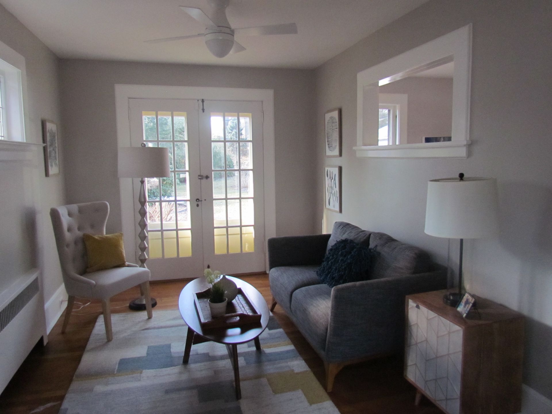 A living room with a couch a chair and a coffee table