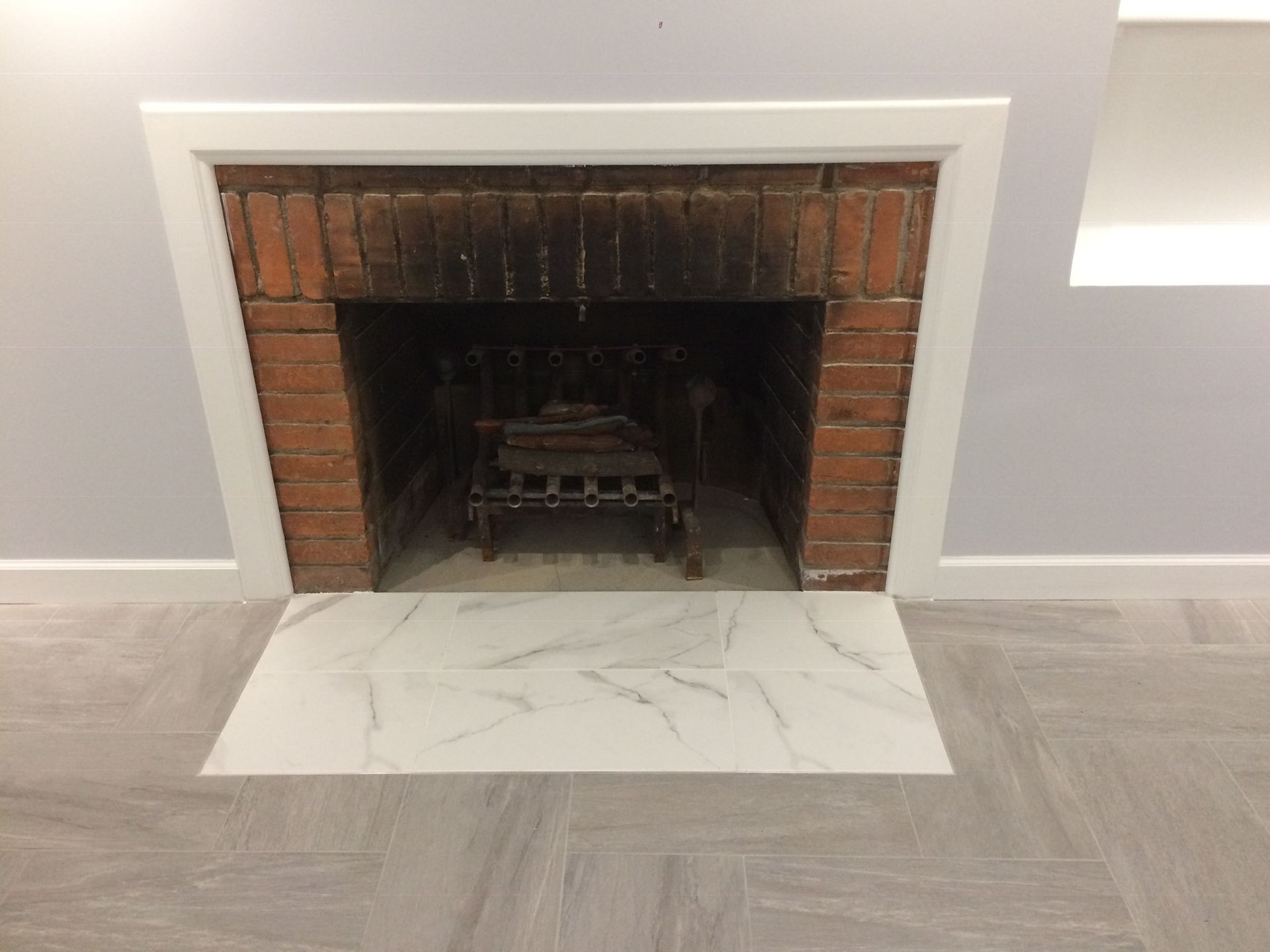 There is a fireplace in the middle of the room.