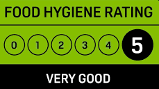 A green sign that says food hygiene rating very good