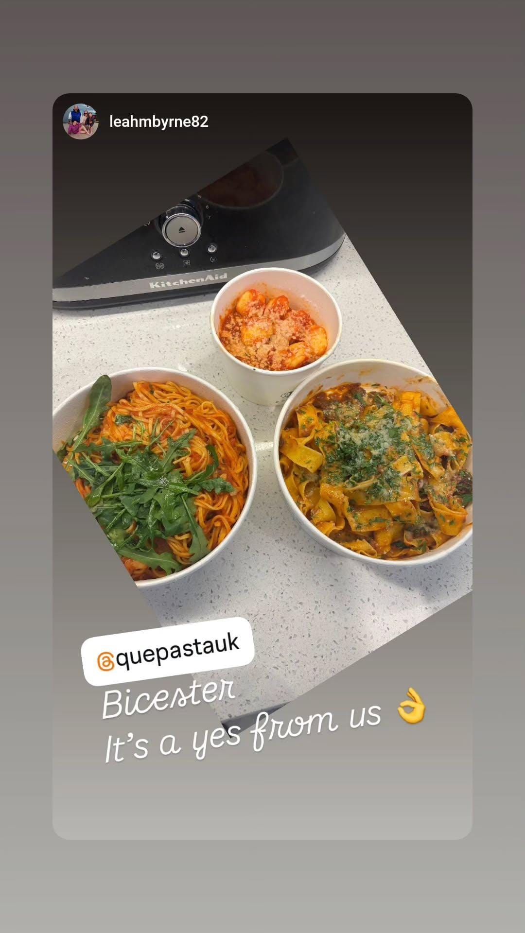 Three bowls of food are sitting on a counter.