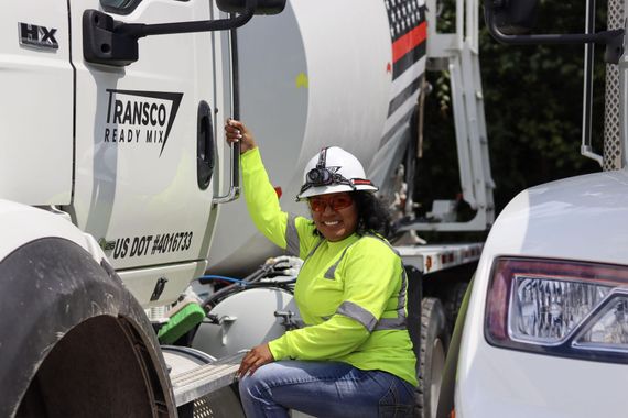 Woman Driver ready to get into  a cement truck