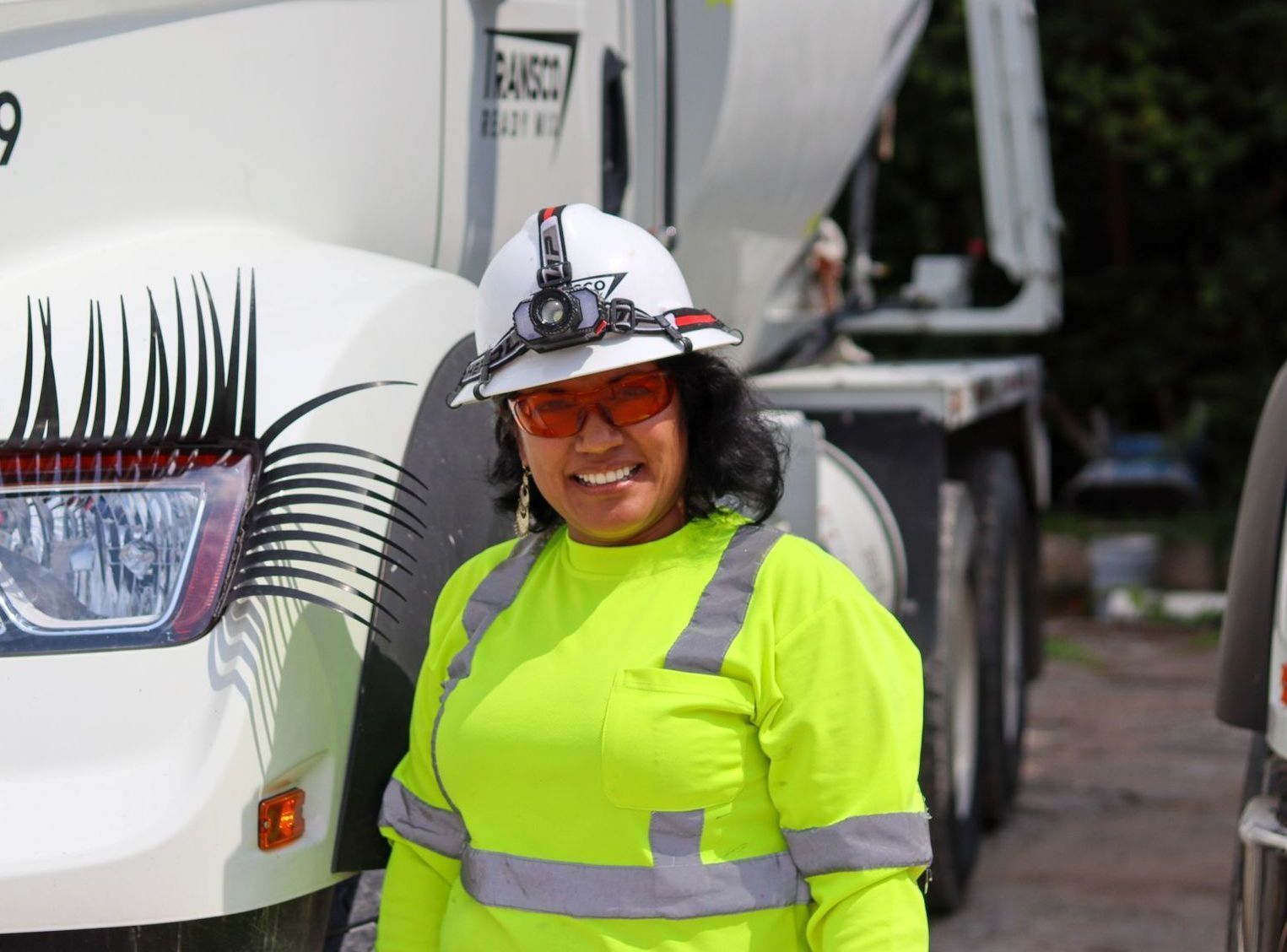 Women concrete truck driver in uniform