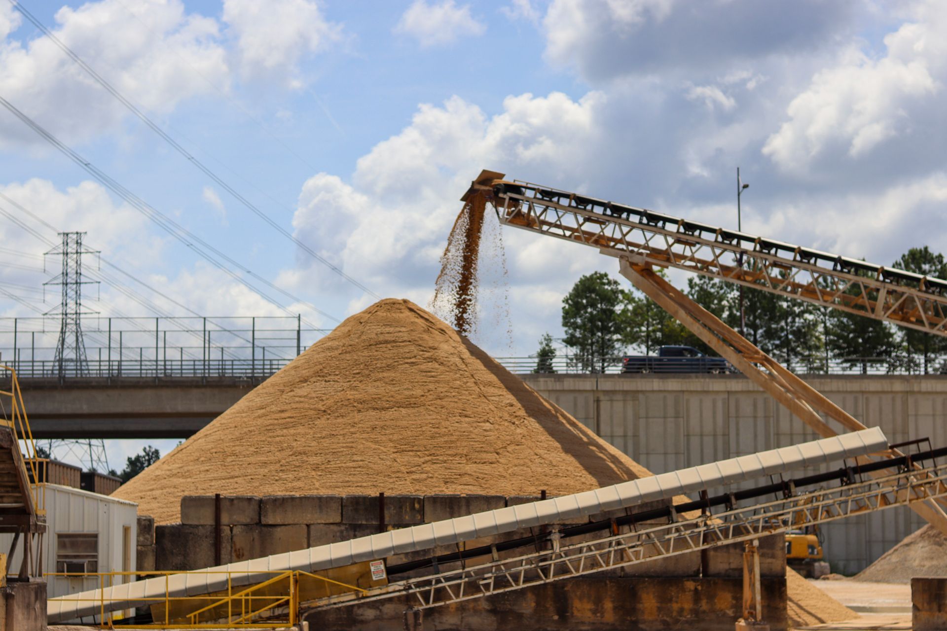 Pile of dry concrete mixture being dumped