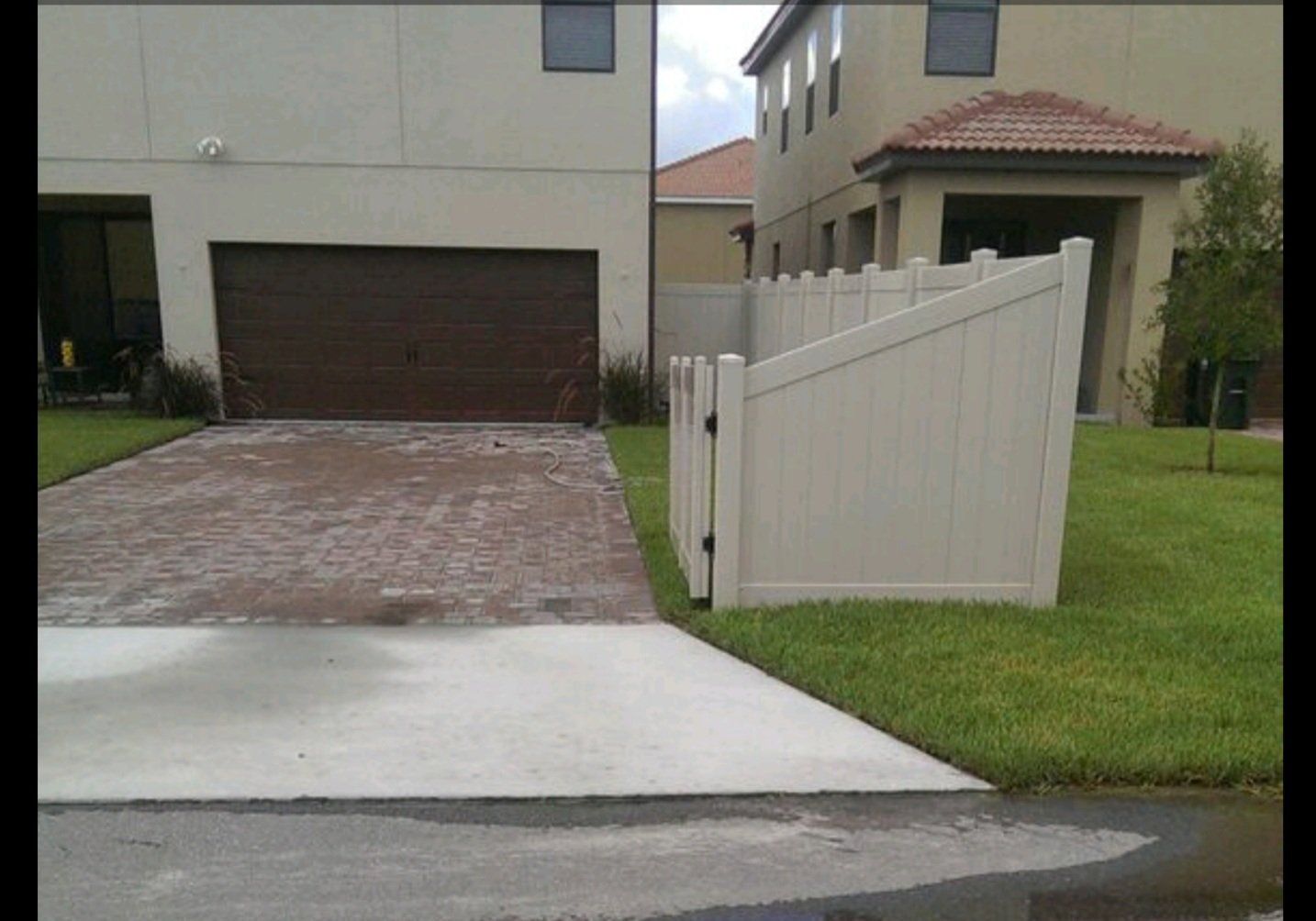 a house with a white fence in front of it