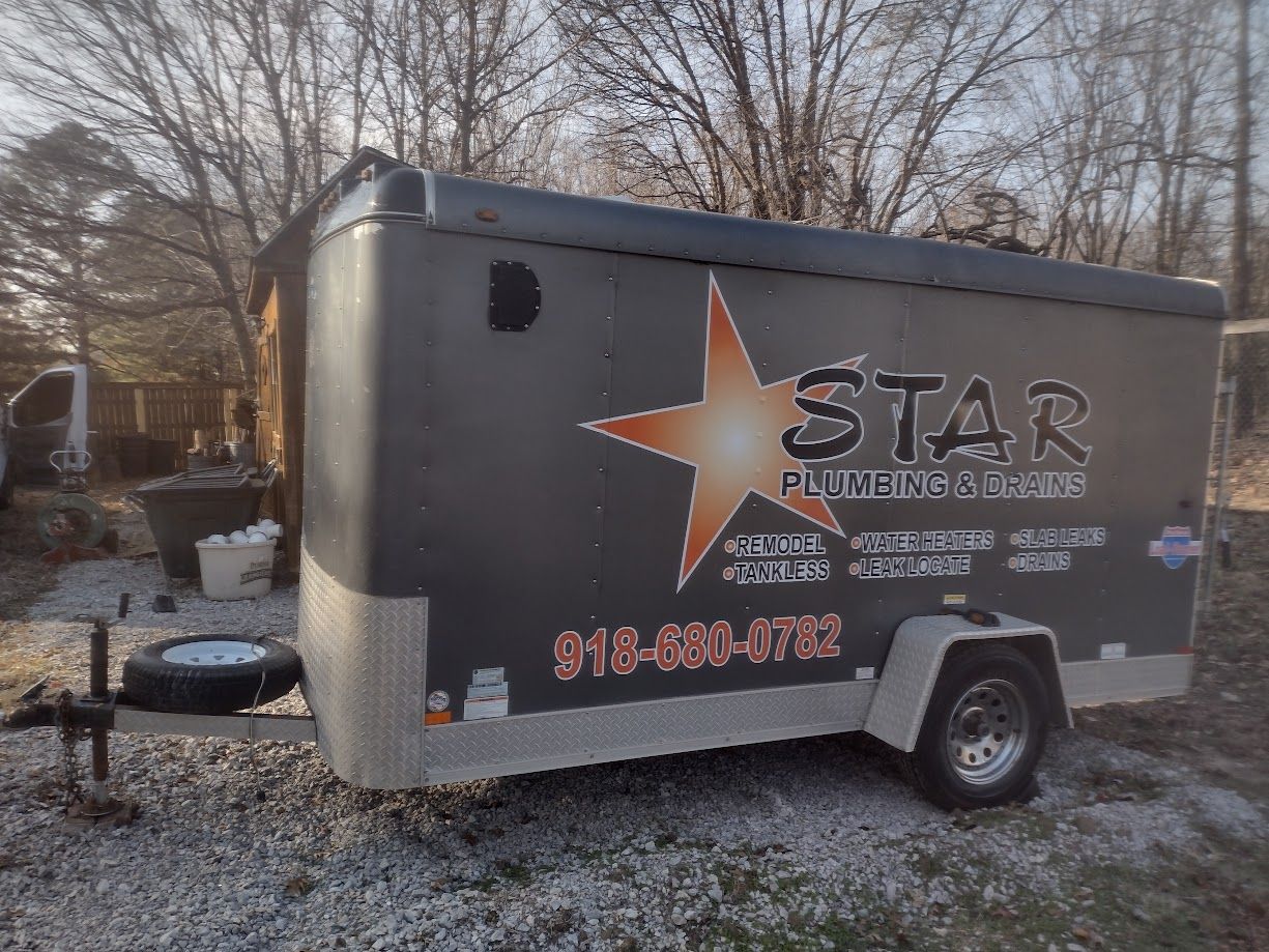 A gray trailer with the logo 