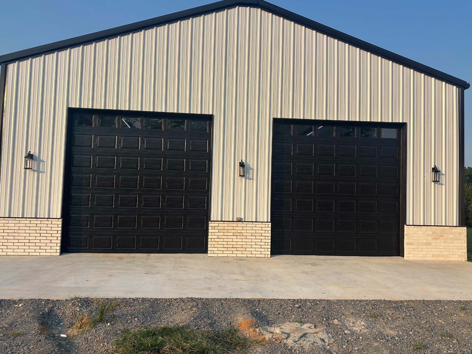 Black Garage Doors on a Metal Building