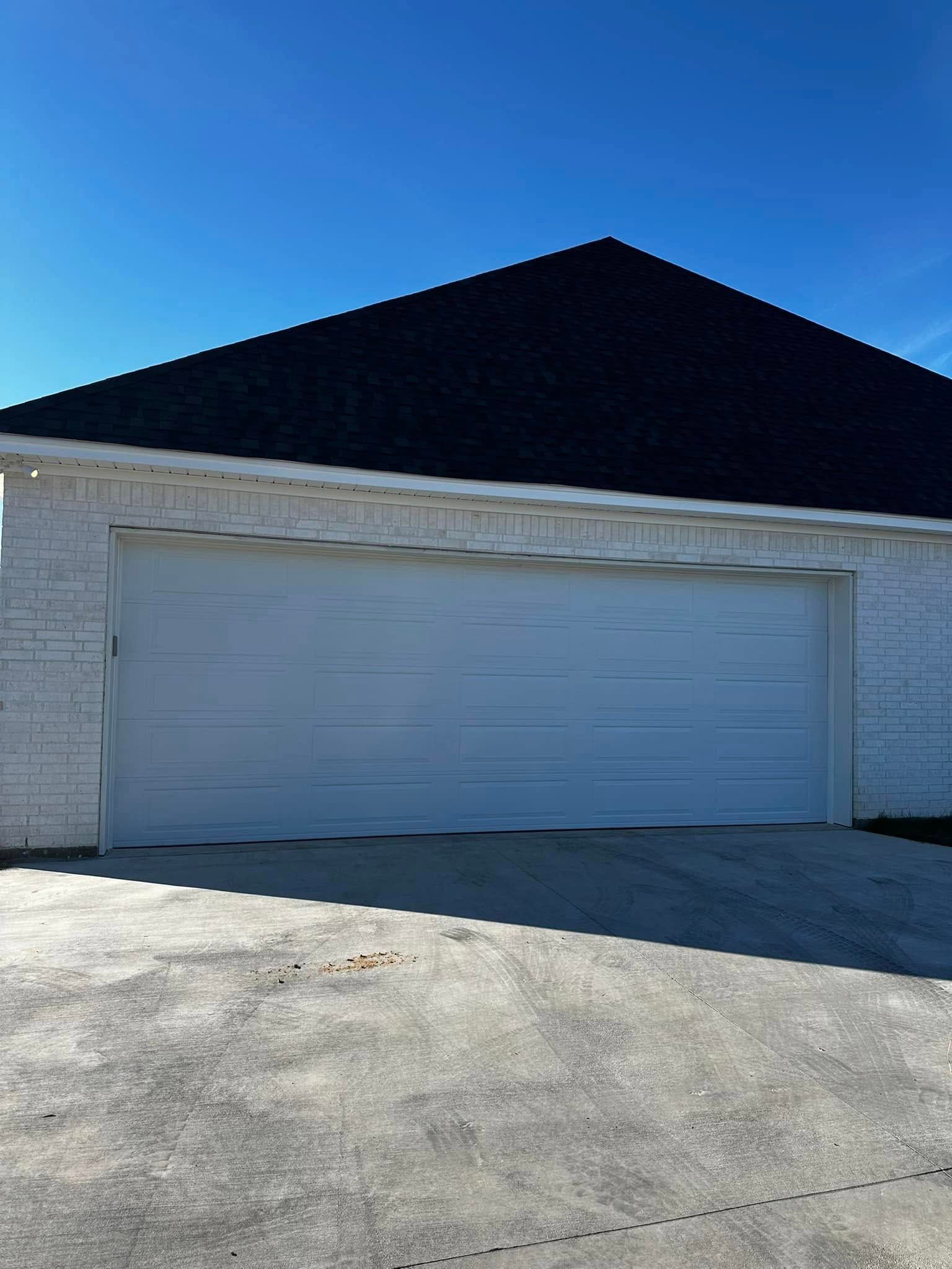 White Garage Door with Brick Wall