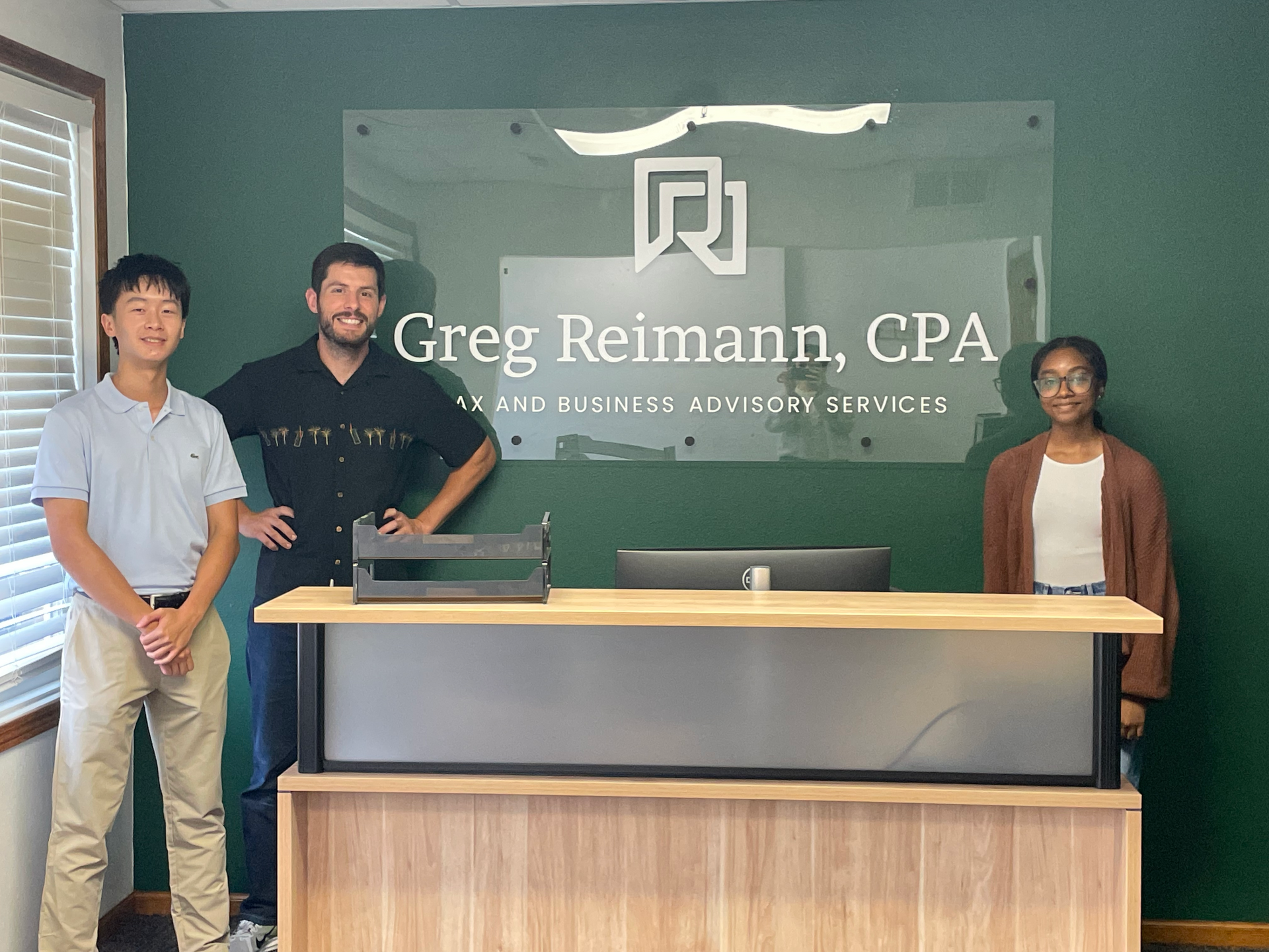 Summer interns from Iowa City community college posing for a photo at Greg Reimann, CPA offic